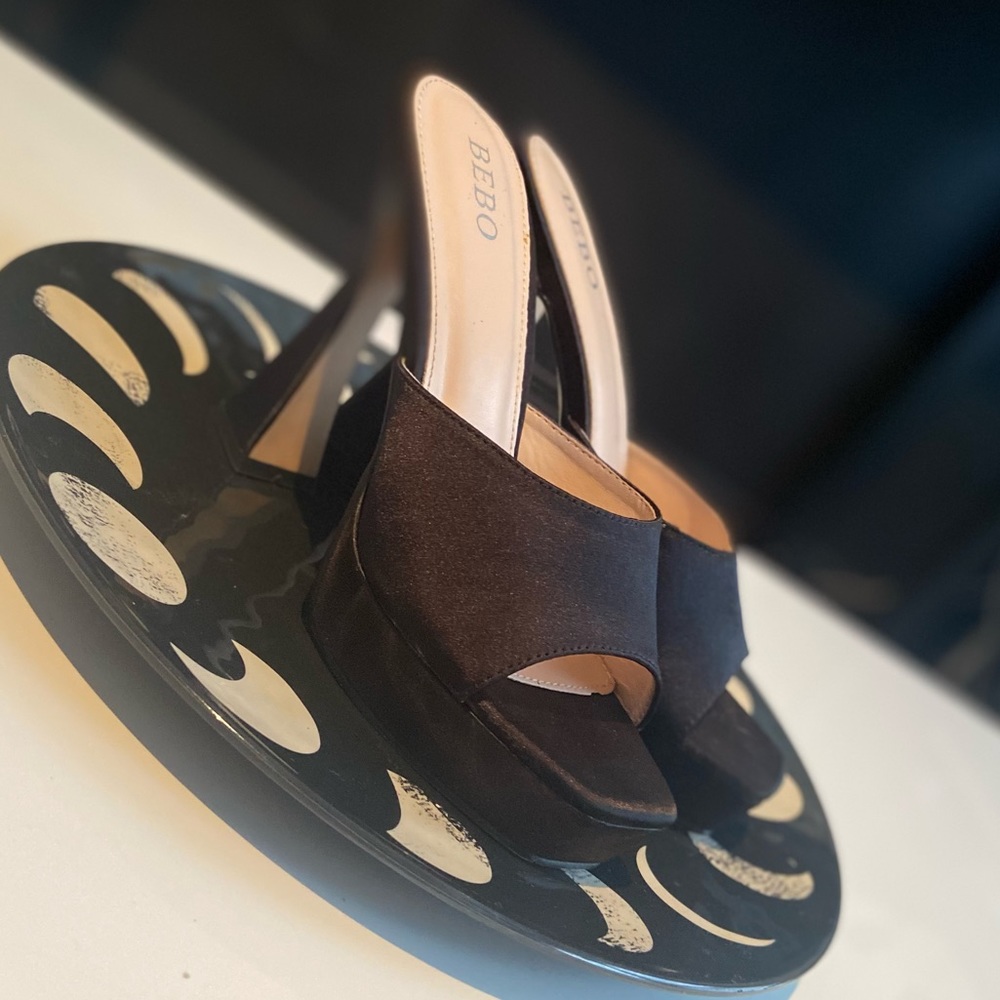 Size 7 black Satin heeled shoe. Shoe heel height is 4 inches.